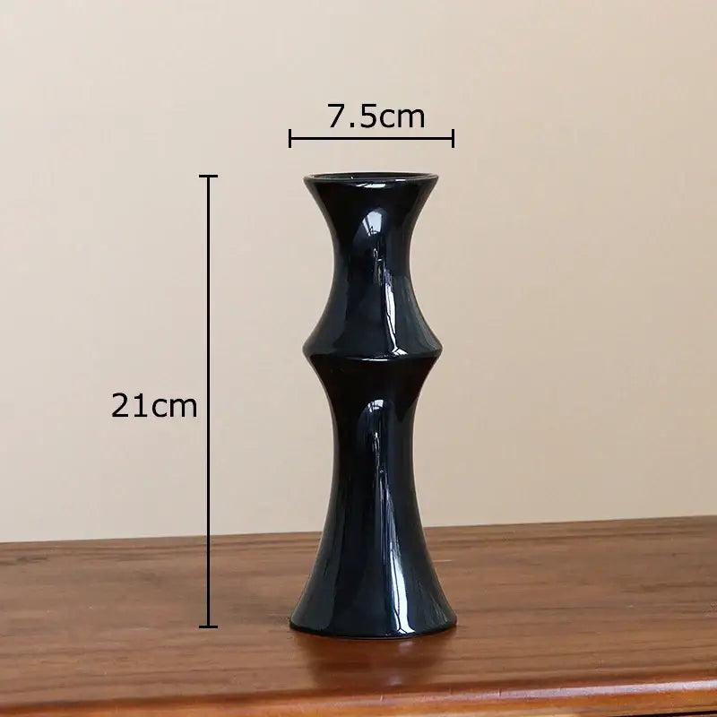 Elegant glossy black bamboo ceramic vase with slender fluted design and tapered base for decorbites bamboo ceramic decor