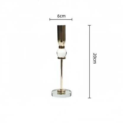 Elegant gold and crystal glass candlestick holder with polished metal stem and clear glass sphere for decorbites decor