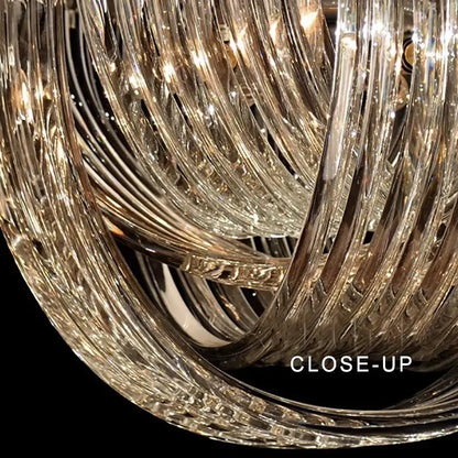 Elegant gold and glass crystal pendant lights with intricate twisted glass arms for kitchen island lighting
