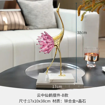 Elegant gold and pink crystal bird decorative figurine with vibrant feathered tail on white marble base for living room decorbites crystal bird