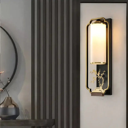 Elegant gold bamboo iron glass wall sconce with frosted shade and ornate floral design for living room lighting