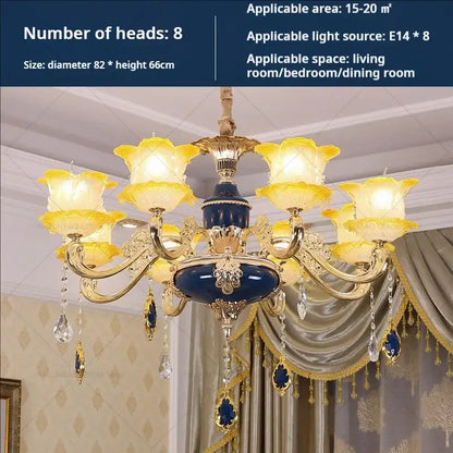 Elegant crystal chandelier with gold-toned metalwork, deep blue body, and amber glass shades by decorbites elegant crystal