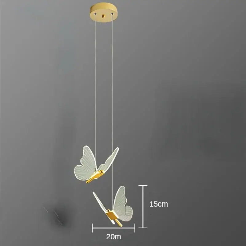 Elegant gold butterfly led pendant light with translucent wings and gold-toned accents for bedroom decor by Decorbites