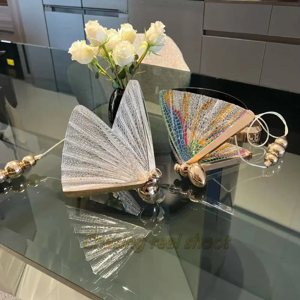 Two ornate butterfly led pendant clutch bags with silver filigree and rainbow mosaic for elegant bedroom decorbites decor