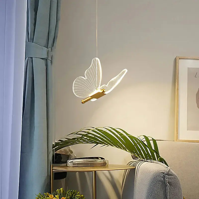 Elegant gold butterfly pendant lamp with translucent wings softly glowing perfect for bedroom decorbites pendant lamp