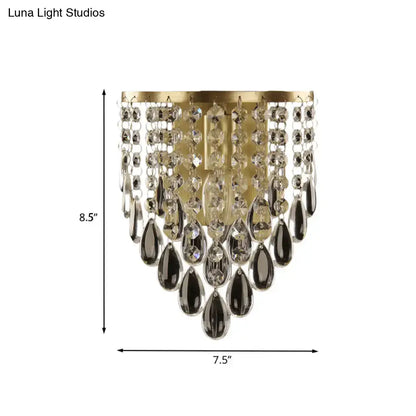 Elegant gold corridor wall mounted semi rounded sconce with beveled glass crystal and cascading dark teardrop crystals
