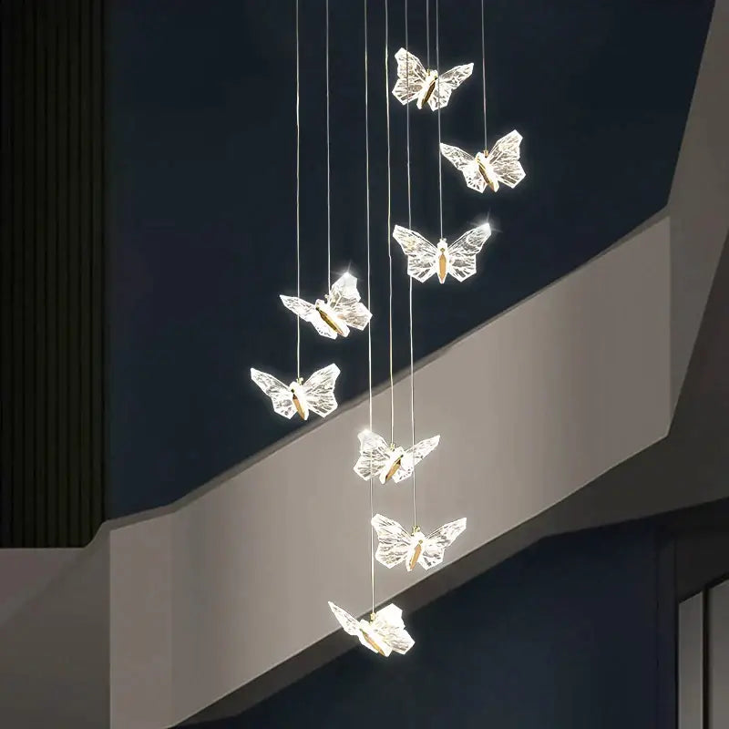Elegant gold crystal butterfly ladder pendant lights feature six translucent butterflies with warm led center lights for stairs decorbites butterfly ladder pendant