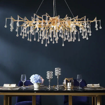 Elegant gold crystal chandelier with intricate branching arms and dangling teardrop pendants for living room decorbites elegant gold