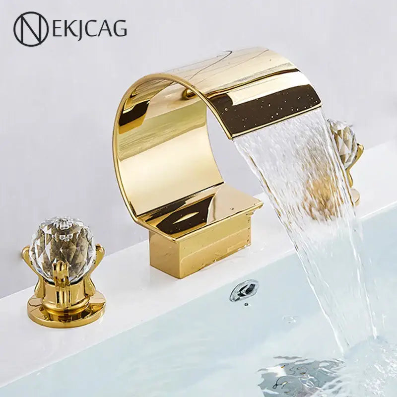 Elegant gold basin faucet set with polished metallic finish and crystal knob featuring a curved waterfall spout design