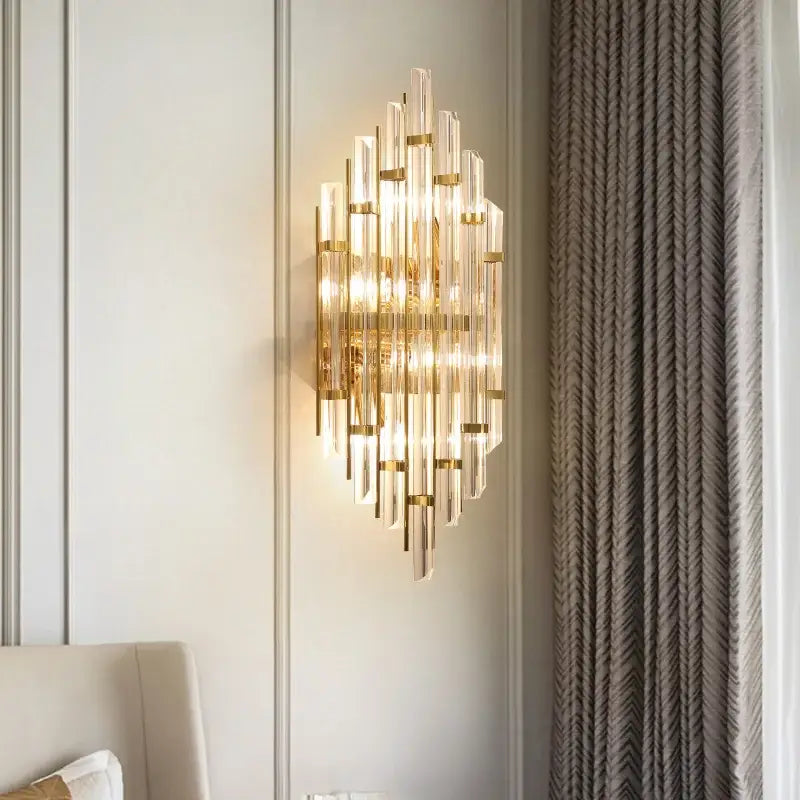 Elegant gold crystal wall lamp featuring clear glass rods in a radiant cascading design for living room wall lamp