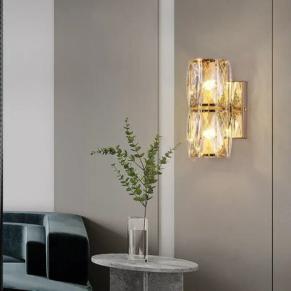 Elegant gold crystal wall lamp featuring faceted crystal accents as a decorbites crystal wall living room sconce