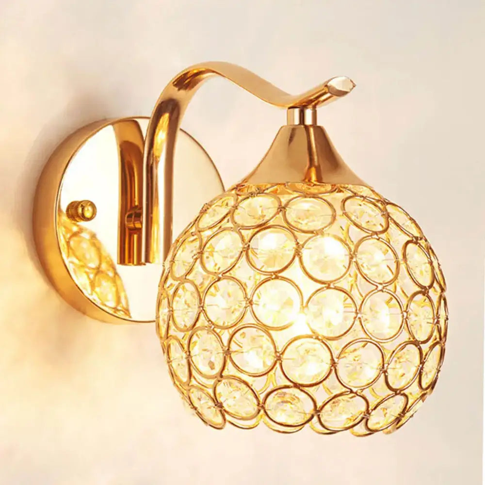 Elegant gold crystal wall sconce featuring a spherical globe design ideal for bedroom decorbites crystal wall lighting
