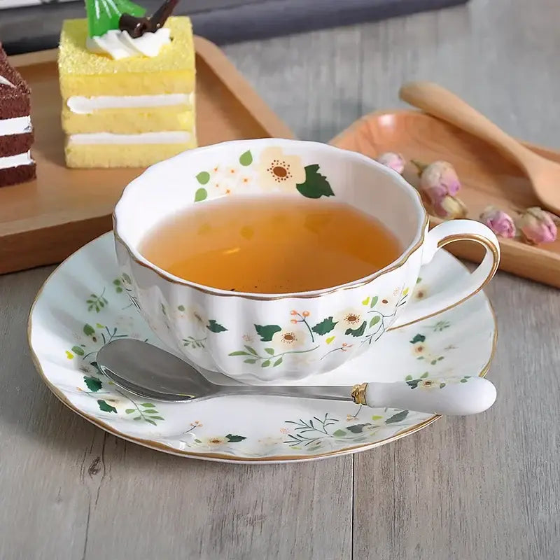 White porcelain teacup and saucer set with elegant gold flower accents and floral patterns for decorbites elegant gold decorbites elegant gold saucer set dining room decor