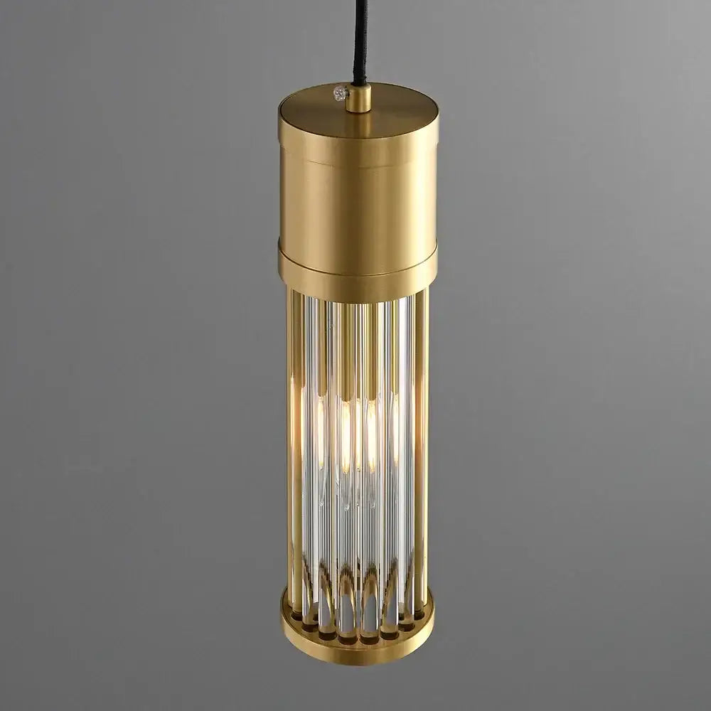 Elegant gold brass cylindrical pendant light with vertical glass rods and warm glow for kitchen and dining room shade pendant lights