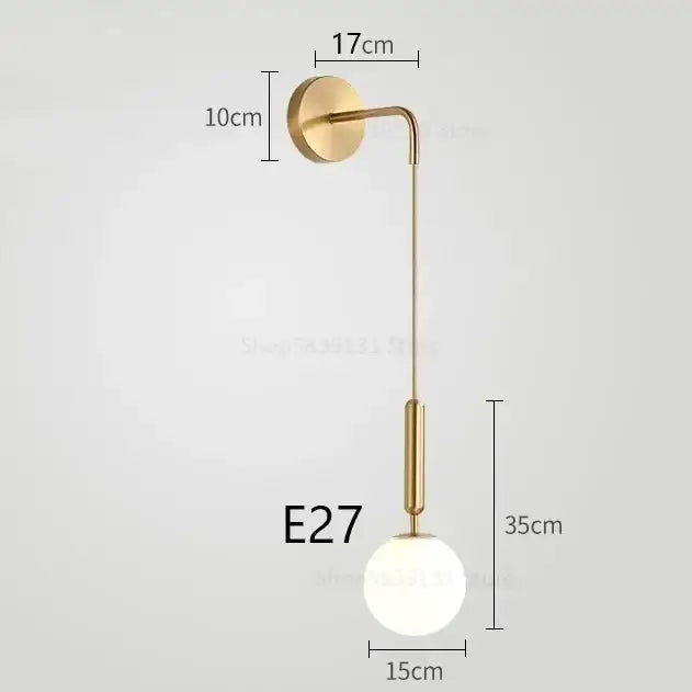 Elegant gold glass wall lamp with frosted globe shade and sleek curved arm for living room decorbites elegant glass lighting
