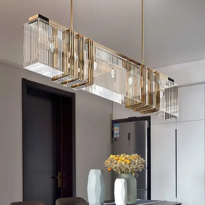 Elegant gold lustre rectangular pendant light with vertical glass rods and exposed bulbs for dining room decorbites elegant gold