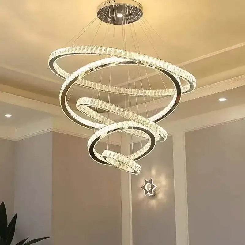 Elegant gold rings chandelier with crystal accents and sleek chrome finish modern spiral design for dining room decorbites elegant gold
