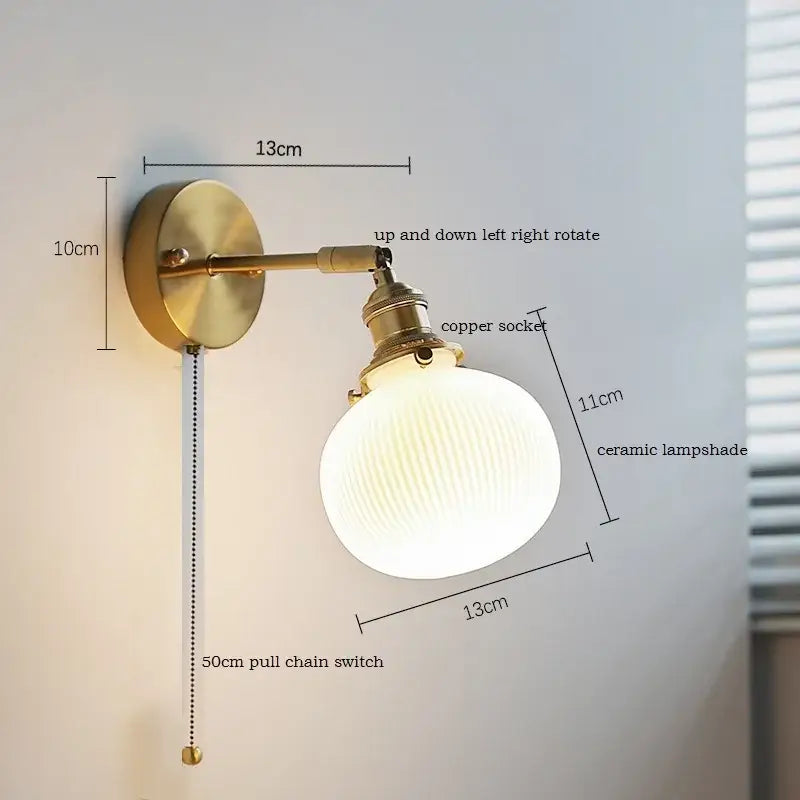 Elegant gold brass-finished wall light with ruffled ceramic led lampshade and copper socket for decorbites ceramic led wall decor