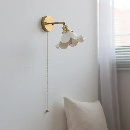 Elegant white ceramic led wall light with fluted petal shade and brass arm for decorbites ceramic led bedroom sconce