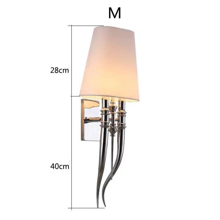 Elegant gold and silver iron claw horn wall sconce with chrome finish tapered off-white fabric shade for bedroom use