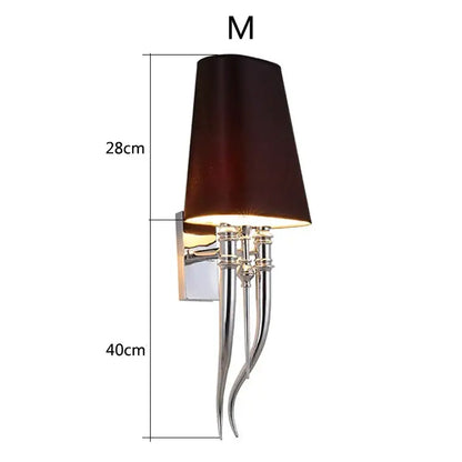 Elegant iron claw horn wall sconce with dark brown fabric shade and polished chrome arms for bedroom use