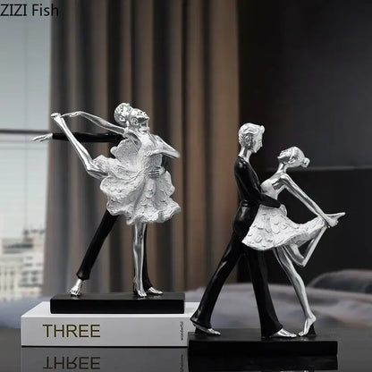 Silver and black ballet dancer figurines with textured costumes on sleek bases perfect for home decor and decorbites golden tango