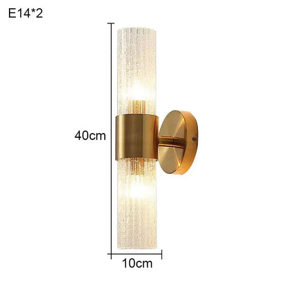 Elegant gold textured glass wall lamp with translucent cylinder and dual light sources for warm bedroom lighting decorbites elegant crystal