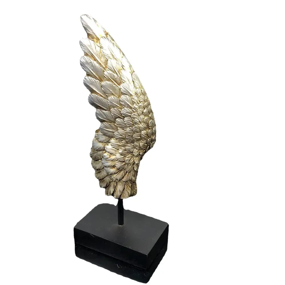 Elegant golden angel wings resin sculpture with detailed feather texture mounted on a black base for living room decor