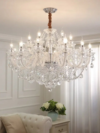 Elegant led crystal chandelier with multiple arms, polished chrome center, and twisted brown cord for dining room lighting