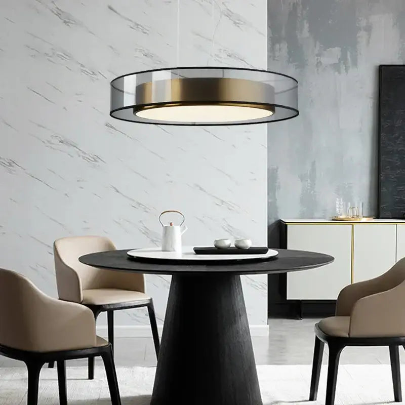 Elegant led dual purpose chandelier featuring a modern black frame, translucent glass shade, and warm gold accent ring