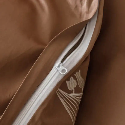 Brown satin duvet cover with subtle embroidered floral design and white zipper in decorbites elegant lily cotton bedding set
