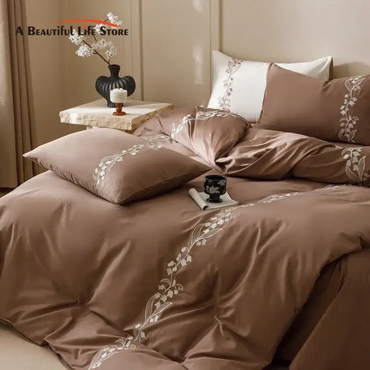 Elegant lily brown and white cotton bedding set with delicate floral embroidery for refined bedroom decorbites use