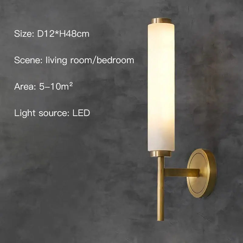 Brass-finished wall sconce with frosted glass cylinder diffuser from decorbites elegant marble copper bedroom lighting