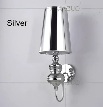 Silver metallic wall lamps with conical shade and ornate base from decorbites guards wall lamps set for bedroom