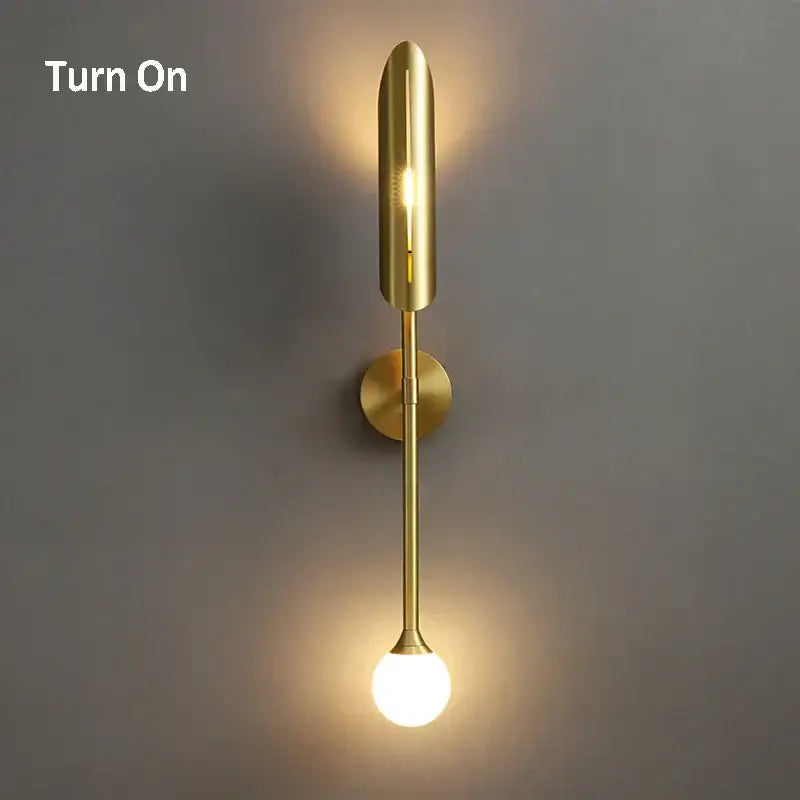 Elegant modern wall lamp in gold tone with sleek vertical design and frosted glass bulb for decorbites elegant modern decor