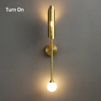 Elegant modern wall lamp in gold tone with sleek vertical design and frosted glass bulb for decorbites elegant modern decor