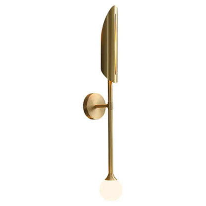 Elegant modern wall lamp in gold with sleek elongated leaf shade and frosted glass globe by decorbites for bedroom sconce