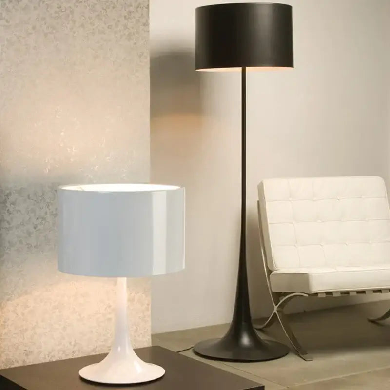 White ceramic table lamp with cylindrical shade and sleek tapered base perfect for decorbites elegant mushroom floor decor
