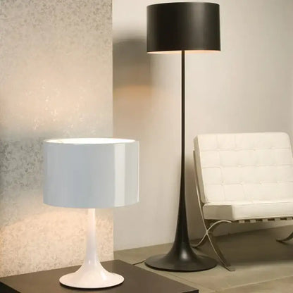White ceramic table lamp with cylindrical shade and sleek tapered base perfect for decorbites elegant mushroom floor decor