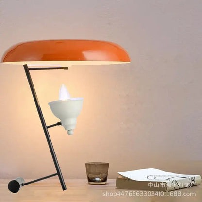 Orange dome-shaped desk lamp with black metal frame and white bulb housing decorbites elegant nordic desk light