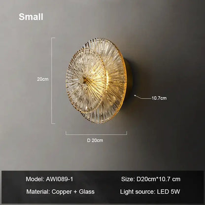 Gold-toned wall sconce with layered radiating glass panels and copper base decorbites elegant glass wall fixture