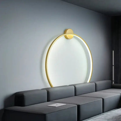 Elegant round gold wall sconce with a glowing ring and minimalist design ideal for bedroom indoor lighting decorbites wall sconces
