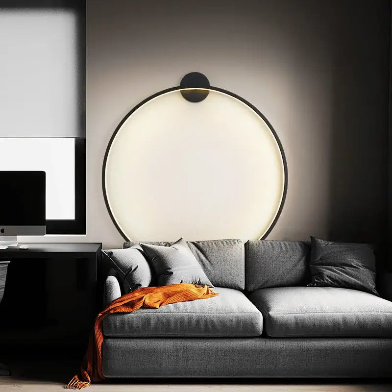 Elegant round wall sconces with a sleek black frame and warm white illumination for bedroom indoor lighting decorbites wall sconces