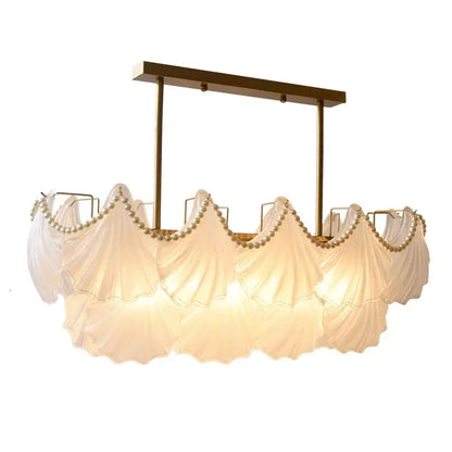 Elegant white fabric-draped pearl chain chandelier with gold metal frame and decorbites crystal pearl accents for dining room decor