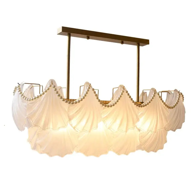 Elegant white fabric-draped pearl chain chandelier with gold metal frame and decorbites crystal pearl accents for dining room decor