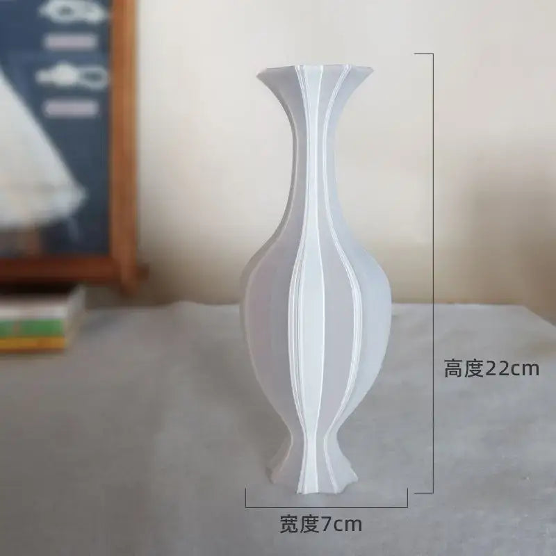 A sleek white ceramic decorbites elegant vase with modern fluted ridges for high-end living room decor