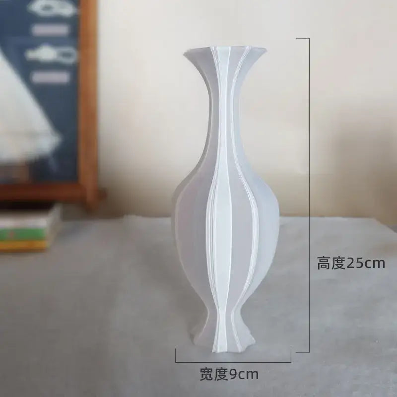 A sleek white ceramic decorbites elegant high-end vase with vertical ridges and flared top for living room decor