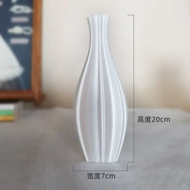 A sleek white ceramic vase with vertical ridges and slender silhouette for decorbites elegant high-end living room decor