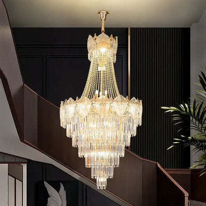 Multi-tiered crystal chandelier with gold-toned metal frame and clear glass prisms for elegant simple staircase decorbites