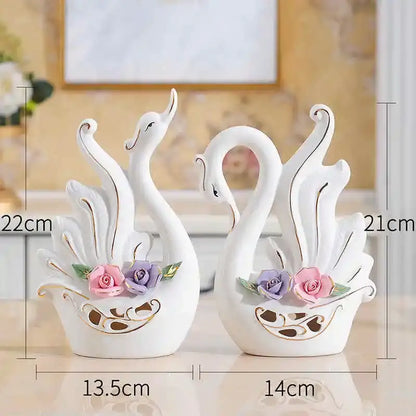 White ceramic swan sculpture figurines with gold trim and pink purple roses for elegant swan decorbites living room decor